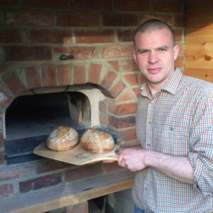 Jonathon with bread made with Prior's Flour